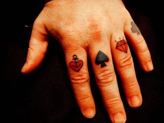  card suits are always a hit for them. This simple red and black tattoo 