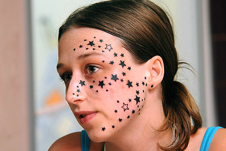  56 stars inked on the left side of her face when she had asked for 3
